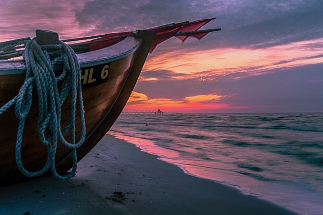 Brown Wooden Boat on Shore during Sunset - Download Free Stock Photos Pikwizard.com