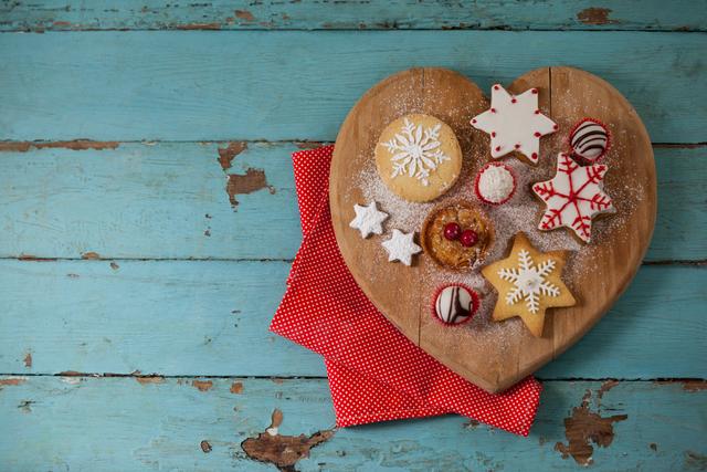 Christmas gingerbread cookies with icing on wooden table