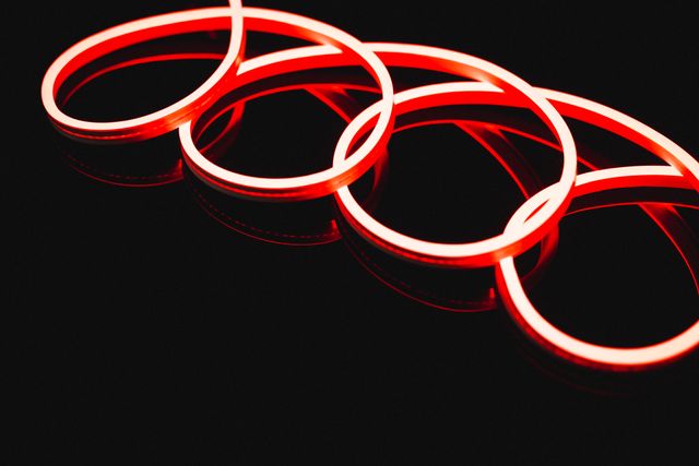 Illustration of illuminated red neon spiral design against black background - Download Free Stock Photos Pikwizard.com