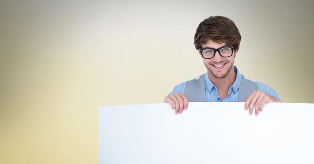 Man wearing eyeglasses while holding blank bill board - Download Free Stock Photos Pikwizard.com