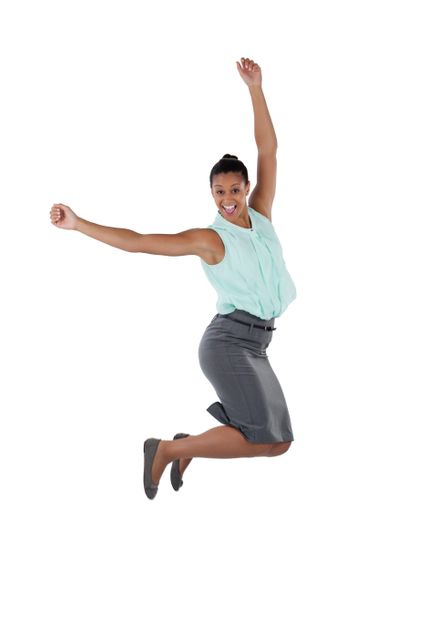 Excited businesswoman jumping in the air - Download Free Stock Photos Pikwizard.com