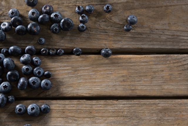 Blueberries on wooden table - Download Free Stock Photos Pikwizard.com