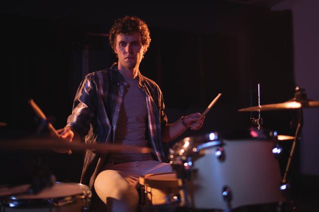Drummer playing on drum set - Download Free Stock Photos Pikwizard.com