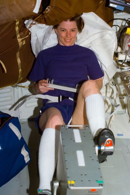 S89-E-5202 (25 Jan 1998) --- This Electronic Still Camera (ESC) image shows mission specialist, Bonnie J. Dunbar, payload commander, working out on the bicycle ergometer onboard the Earth-orbiting Space Shuttle Endeavour.  This ESC view was taken on January 25, 1998, at 18:36:52 GMT.