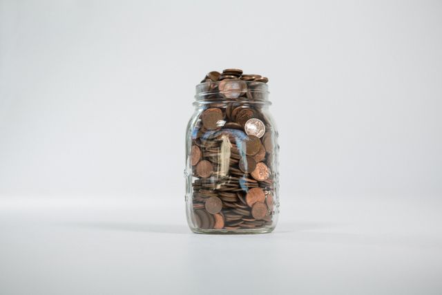 Glass jar full of coins - Download Free Stock Photos Pikwizard.com