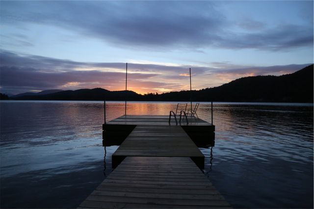 a dock at sunset - Download Free Stock Photos Pikwizard.com