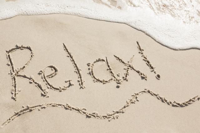 Relax written on sand - Download Free Stock Photos Pikwizard.com