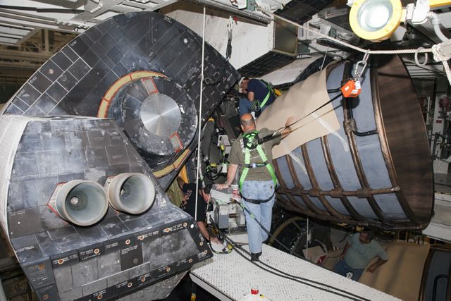 CAPE CANAVERAL, Fla. – In Orbiter Processing Facility Bay 2 at NASA’s Kennedy Space Center in Florida, United Space Alliance technicians install a heat shield around one of space shuttle Endeavour’s replica shuttle main engines.      The work is part of Transition and Retirement of the remaining space shuttles, Endeavour and Atlantis. Endeavour is being prepared for public display at the California Science Center in Los Angeles. Its ferry flight to California is targeted for mid-September. Endeavour was the last space shuttle added to NASA’s orbiter fleet. Over the course of its 19-year career, Endeavour spent 299 days in space during 25 missions. For more information, visit http://www.nasa.gov/transition Photo credit: NASA/ Frankie Martin