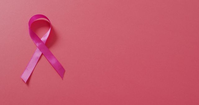 Image of pink breast cancer ribbon on dark pink background - Download Free Stock Photos Pikwizard.com