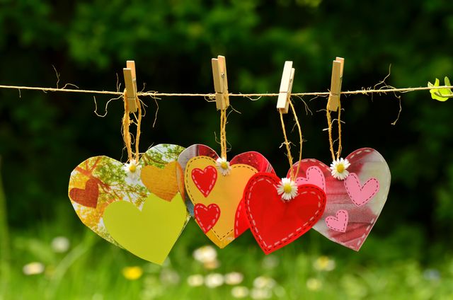 Close up view of heart shaped decorations hanging on the rope. Love and decoration concept