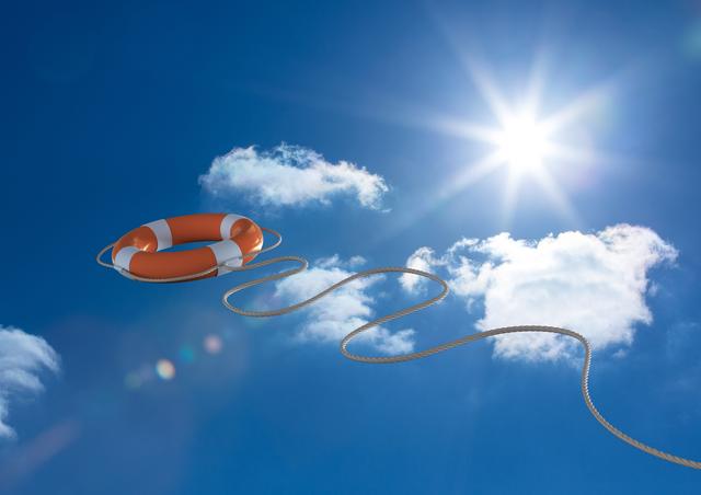 Lifebuoy with rope thrown in mid-air on a sunny day - Download Free Stock Photos Pikwizard.com