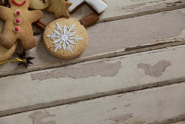 Christmas cookies and cinnamon on a plank