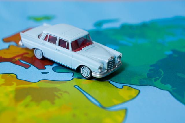 Miniature car on a map - Download Free Stock Photos Pikwizard.com