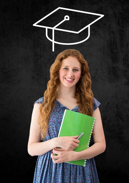 Woman standing and holding book with graduation cap in background - Download Free Stock Photos Pikwizard.com