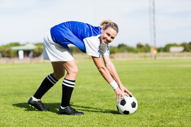 Portrait of female football player keeping a ball - Download Free Stock Photos Pikwizard.com