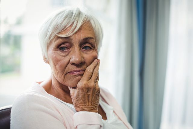 Close-up of worried senior woman - Download Free Stock Photos Pikwizard.com