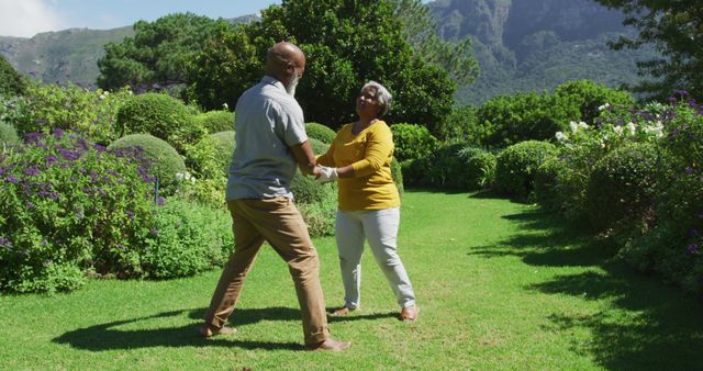 African american senior couple dancing together in the garden - Download Free Stock Photos Pikwizard.com