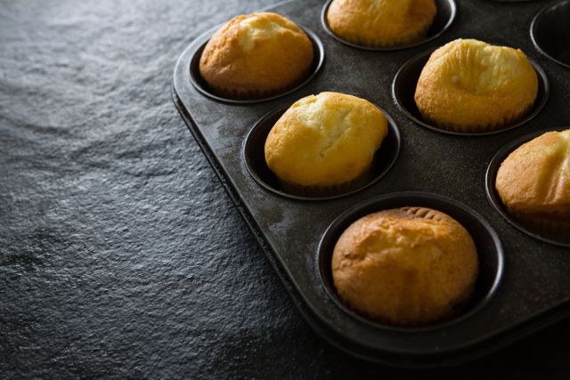 Plain cupcakes on baking tray - Download Free Stock Photos Pikwizard.com