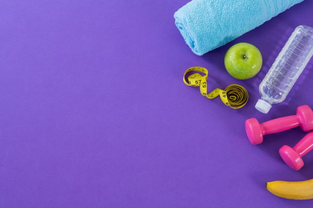 Dumbbell, apple, towel, water bottle and measuring tape - Download Free Stock Photos Pikwizard.com