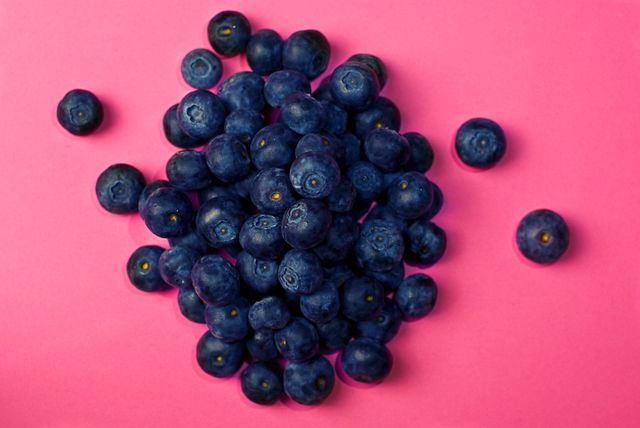 blueberries on a pink background - Download Free Stock Photos Pikwizard.com