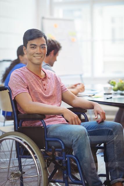 Portrait of handicapped business executive sitting in wheel chair