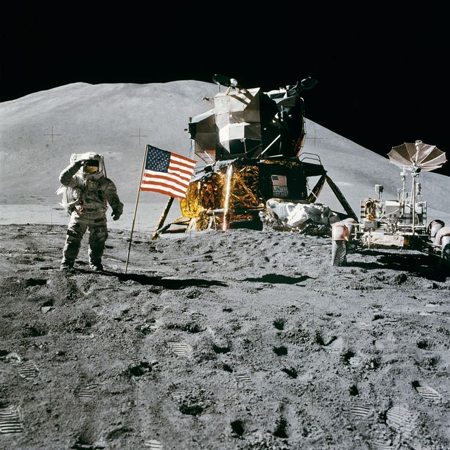 Astronaut Standing Beside American Flag on the Moon - Download Free Stock Photos Pikwizard.com
