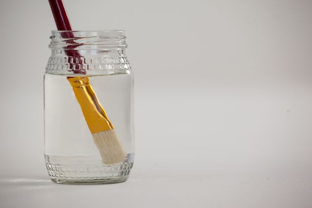 Paint brush in a jar filled with water - Download Free Stock Photos Pikwizard.com