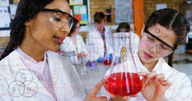Image of mathematical equations over two diverse girls in science class in laboratory at school - Download Free Stock Photos Pikwizard.com