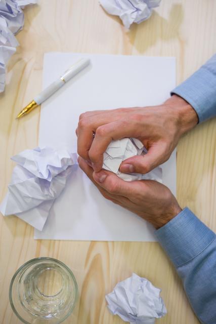 Hands of business executive making paper ball - Download Free Stock Photos Pikwizard.com