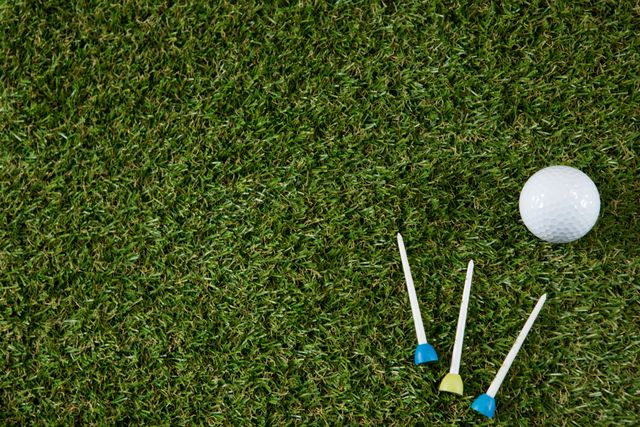 Overhead view of golf ball with tee on field - Download Free Stock Photos Pikwizard.com