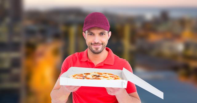 Confident delivery man holding pizza - Download Free Stock Photos Pikwizard.com