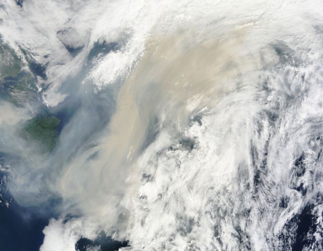 Generally the old saying “where there is smoke, there is fire” rings true, but when thick, hot smoke rises high aloft into the atmosphere it may travel hundreds, sometimes thousands of kilometers away from the source.  This was the case on July 6, 2013 when the Moderate Resolution Imaging Spectroradiometer (MODIS) instrument flying on NASA’s Terra satellite captured this true-color image of a thick river of smoke curling across the Atlantic Ocean.  In the west of the image, the green land of Canada can be seen, most of which is covered by a thin gray haze. A thick veil of smoke obscures much of southern Canada, and this tan-gray veil blows to the east, then to the northeast. The color of the smoke appears both tan and gray, and is stretched into brush-stroke like curves across the ocean, which disappears from view under the smoke. The smoke filled plume is so high that it even hides the bright white clouds from view as it travels over them.  Fires have been burning across Canada since early June, especially in Manitoba and Quebec. Rain in Quebec on July 5 helped diminish the fires in that location, although a severe fire was ignited when a freight train carrying oil derailed in the small, picturesque town of Lac-Megantic. This accident, which occurred on July 6, the same day this image was captured, killed at least 35 people and poured thick smoke into the skies.  Credit: NASA/GSFC/Jeff Schmaltz/MODIS Land Rapid Response Team  <b><a href="http://www.nasa.gov/audience/formedia/features/MP_Photo_Guidelines.html" rel="nofollow">NASA image use policy.</a></b>  <b><a href="http://www.nasa.gov/centers/goddard/home/index.html" rel="nofollow">NASA Goddard Space Flight Center</a></b> enables NASA’s mission through four scientific endeavors: Earth Science, Heliophysics, Solar System Exploration, and Astrophysics. Goddard plays a leading role in NASA’s accomplishments by contributing compelling scientific knowledge to advance the Agency’s mission.  <b>Follow us on <a href="http://twitter.com/NASA_GoddardPix" rel="nofollow">Twitter</a></b>  <b>Like us on <a href="http://www.facebook.com/pages/Greenbelt-MD/NASA-Goddard/395013845897?ref=tsd" rel="nofollow">Facebook</a></b>  <b>Find us on <a href="http://instagram.com/nasagoddard?vm=grid" rel="nofollow">Instagram</a></b>