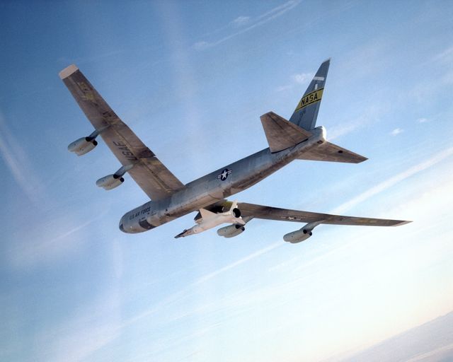 NASA's B-52 mother ship carries the X-43A and its booster rocket on a captive carry flight Jan. 26, 2004 - Download Free Stock Photos Pikwizard.com