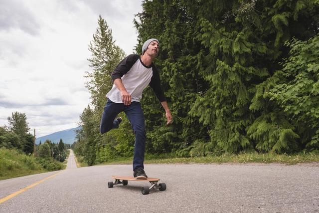 Man skateboarding on the road - Download Free Stock Photos Pikwizard.com