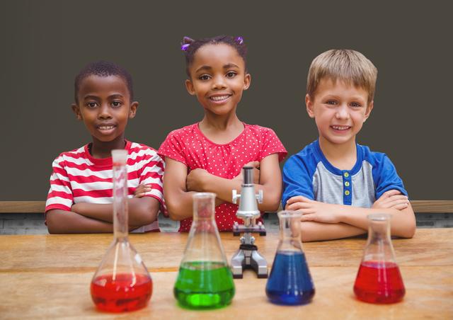 Children standing with arms crossed in chemistry lab - Download Free Stock Photos Pikwizard.com