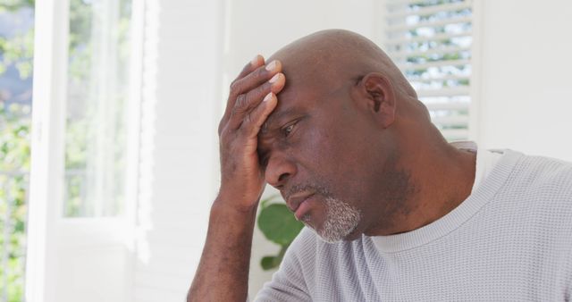 Tired african american senior man having headache - Download Free Stock Photos Pikwizard.com