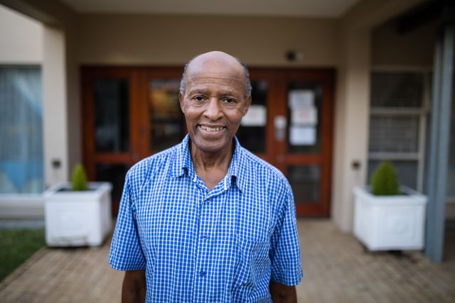 Portrait of smiling senior man at nursing home - Download Free Stock Photos Pikwizard.com
