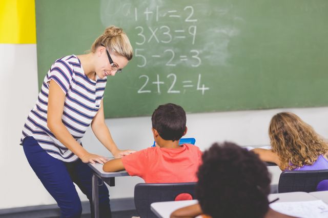 Teacher teaching mathematics to school kids in classroom - Download Free Stock Photos Pikwizard.com