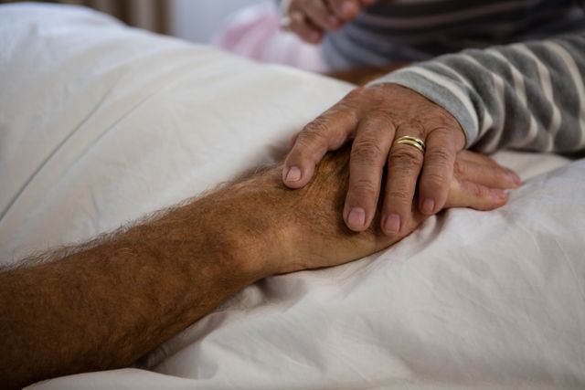 Hands of senior couple relaxing in nursing home - Download Free Stock Photos Pikwizard.com