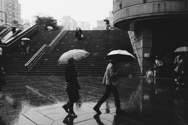 people walking in the rain - Download Free Stock Photos Pikwizard.com