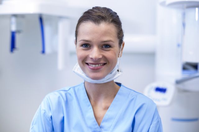 Smiling dental assistant in dental clinic - Download Free Stock Photos Pikwizard.com