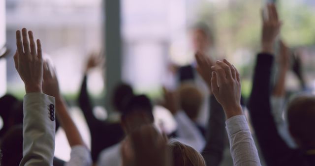 Rear view of diverse business professionals raising their hands in a business seminar. Female speaker speaks in a business seminar 4k