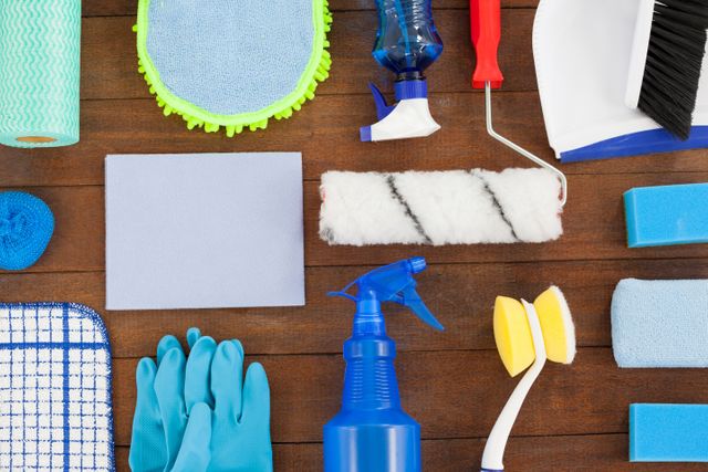 Various cleaning equipment arranged on wooden floor - Download Free Stock Photos Pikwizard.com