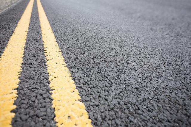 Yellow road marking on road surface - Download Free Stock Photos Pikwizard.com