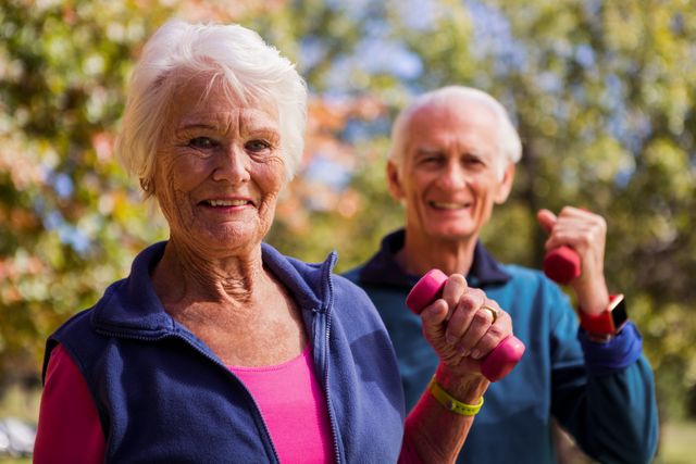 Elderly couple making fitness and lifting hand weight - Download Free Stock Photos Pikwizard.com