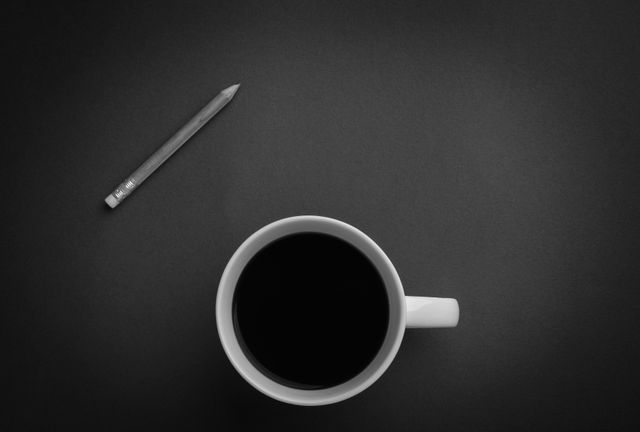 White Ceramic Coffee Mug on Black Table - Download Free Stock Photos Pikwizard.com
