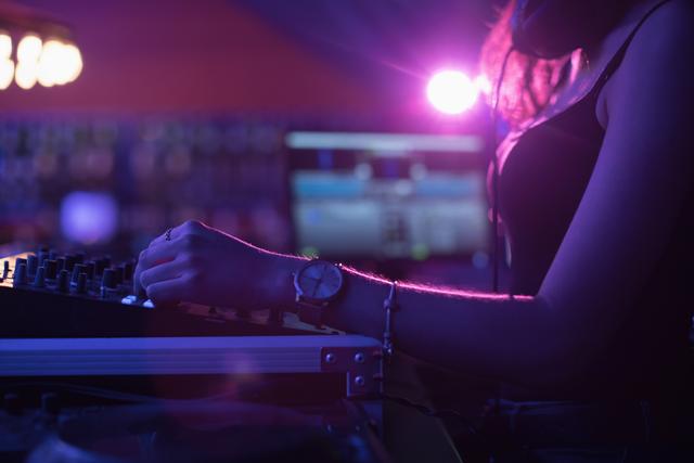 Female dj mixing music in bar - Download Free Stock Photos Pikwizard.com