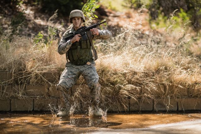 Military soldier with rifle jumping in water - Download Free Stock Photos Pikwizard.com