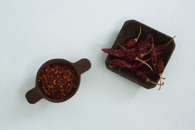 Dried red chili pepper and crushed red pepper in bowl - Download Free Stock Photos Pikwizard.com