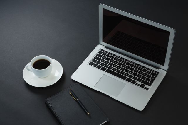 Black coffee, pen, organizer and laptop on black background - Download Free Stock Photos Pikwizard.com